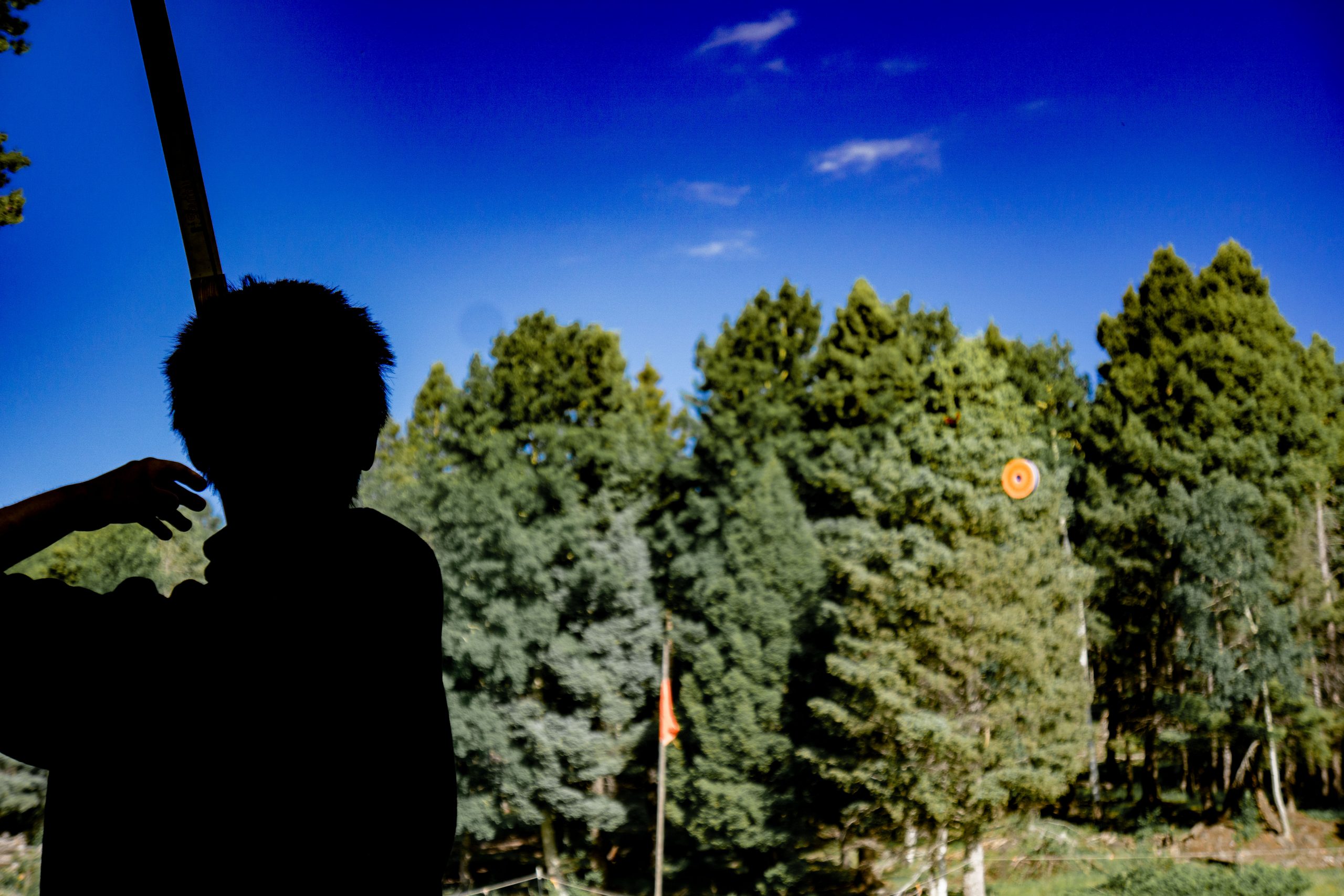 A scout shooting aerial archery at Apache Springs
