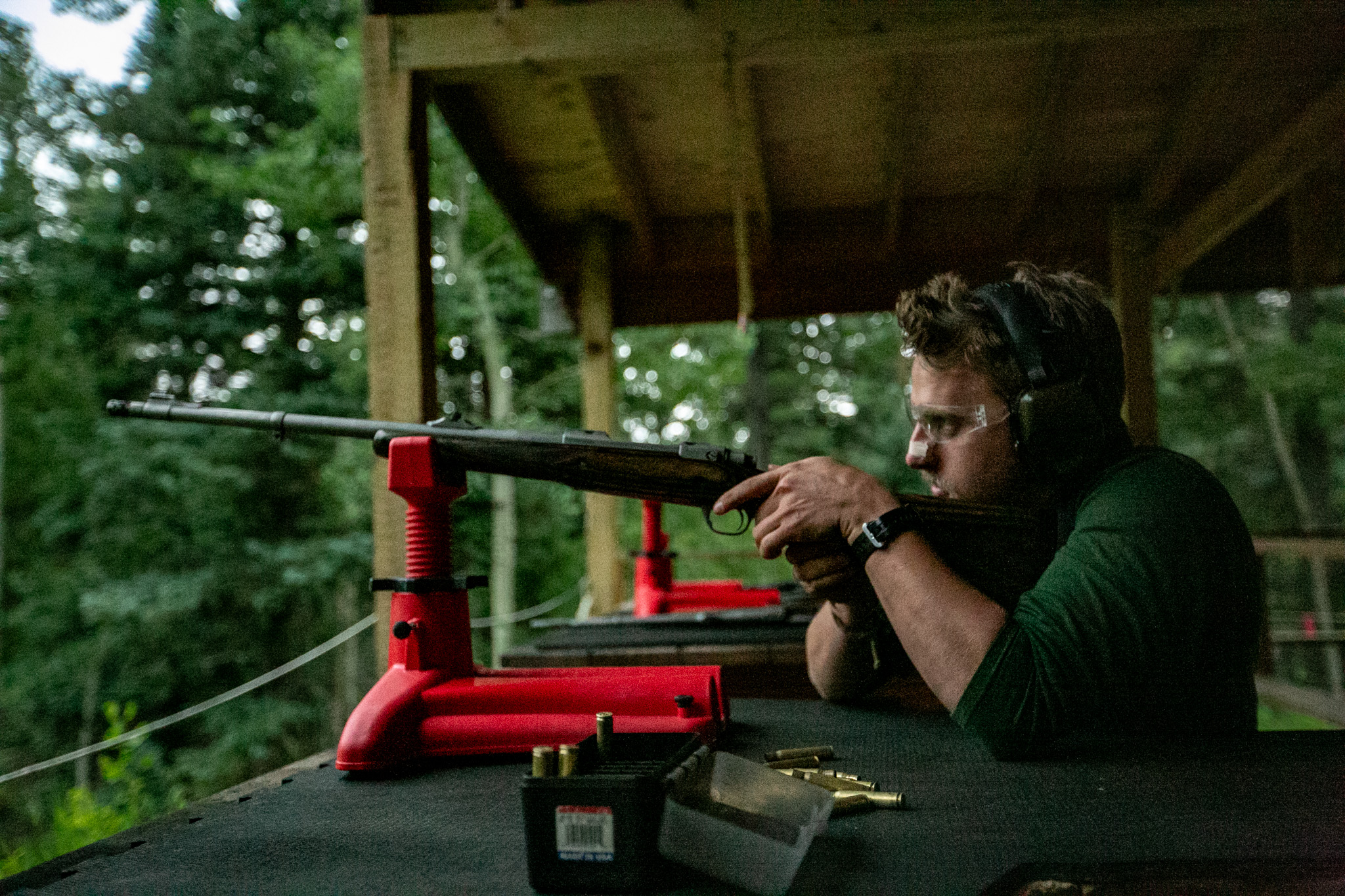 A staff member safely shoots rifle at sawmill